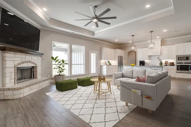 a living room with furniture fireplace and flat screen tv