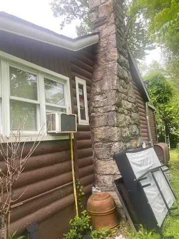 a front view of a house with chairs