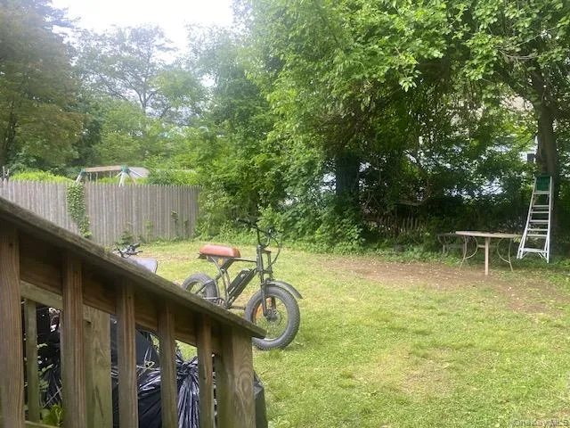 a view of swimming pool with a patio and a yard