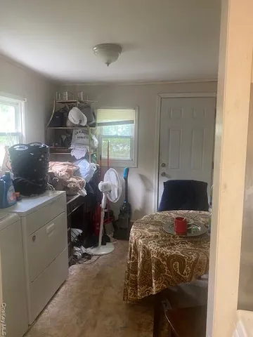 a bedroom with bed and window