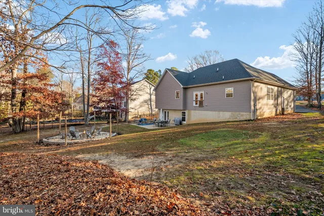 a view of a swimming pool with a yard