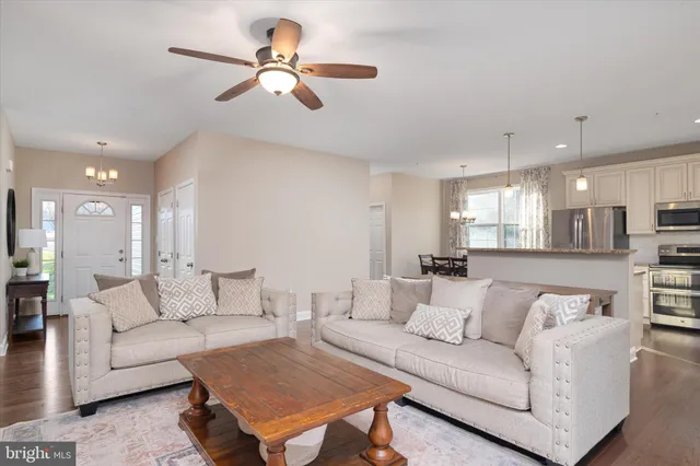 a kitchen with granite countertop stainless steel appliances and refrigerator