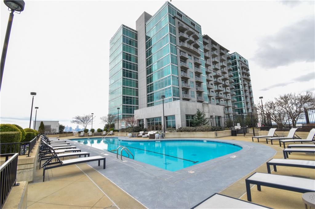 250 Pharr Road Northeast, Unit 1103 Atlanta, GA 30305 - Photo 11 of 16 a view of buildings with swimming pool