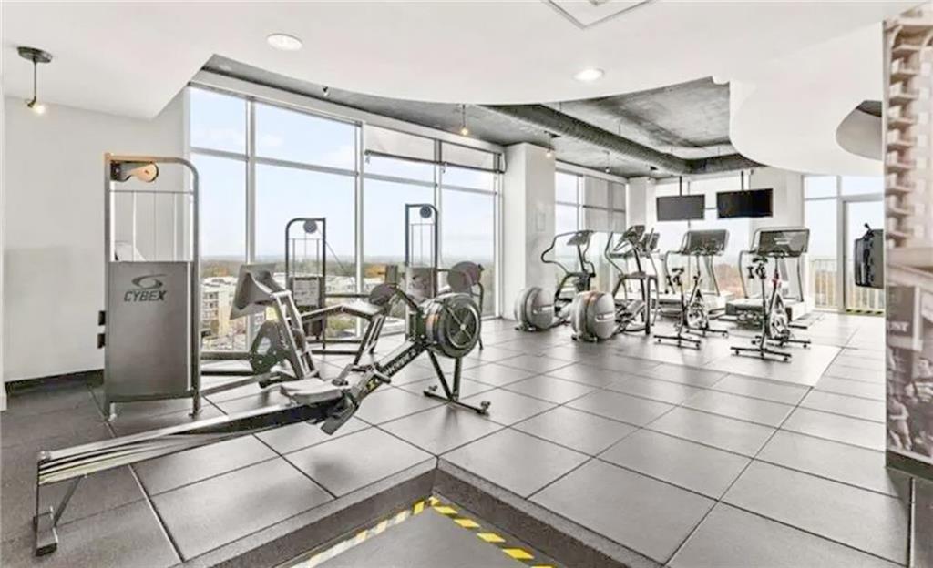 250 Pharr Road Northeast, Unit 1103 Atlanta, GA 30305 - Photo 14 of 16 a gym with lots of gym equipment