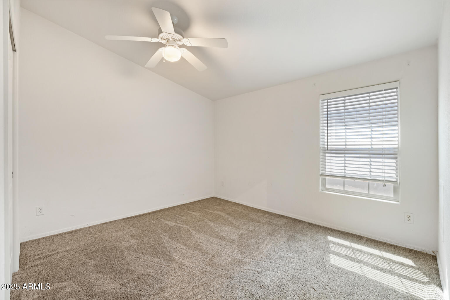 1706 East John Cabot Road Phoenix, AZ 85022 - Photo 15 of 26 an empty room with windows and fan
