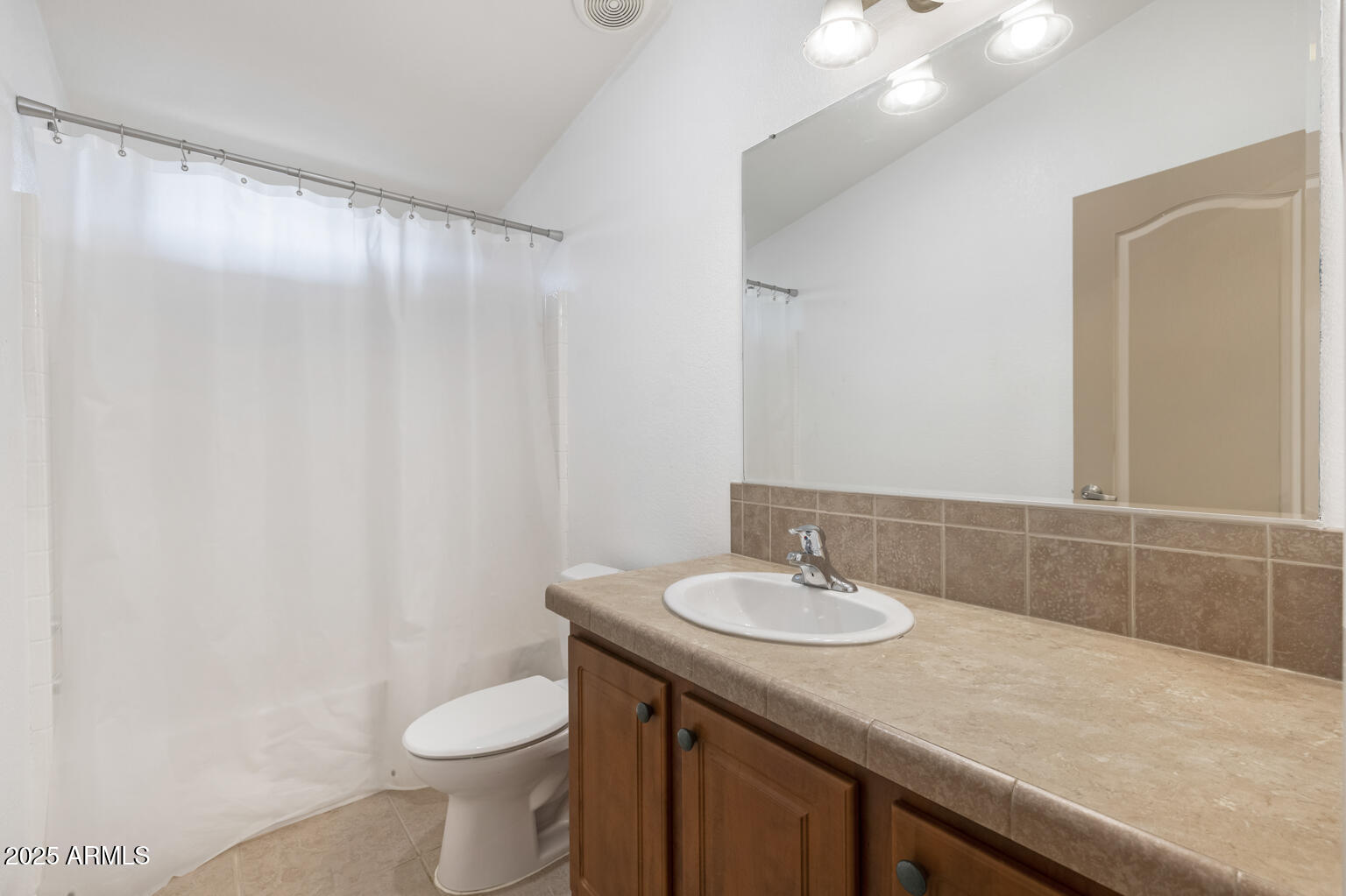 1706 East John Cabot Road Phoenix, AZ 85022 - Photo 18 of 26 a bathroom with a sink and a mirror