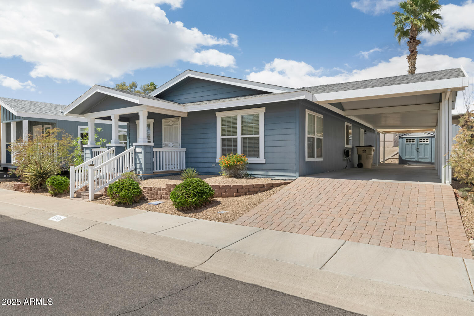 1706 East John Cabot Road Phoenix, AZ 85022 - Photo 2 of 26 a front view of a house with a yard and potted plants