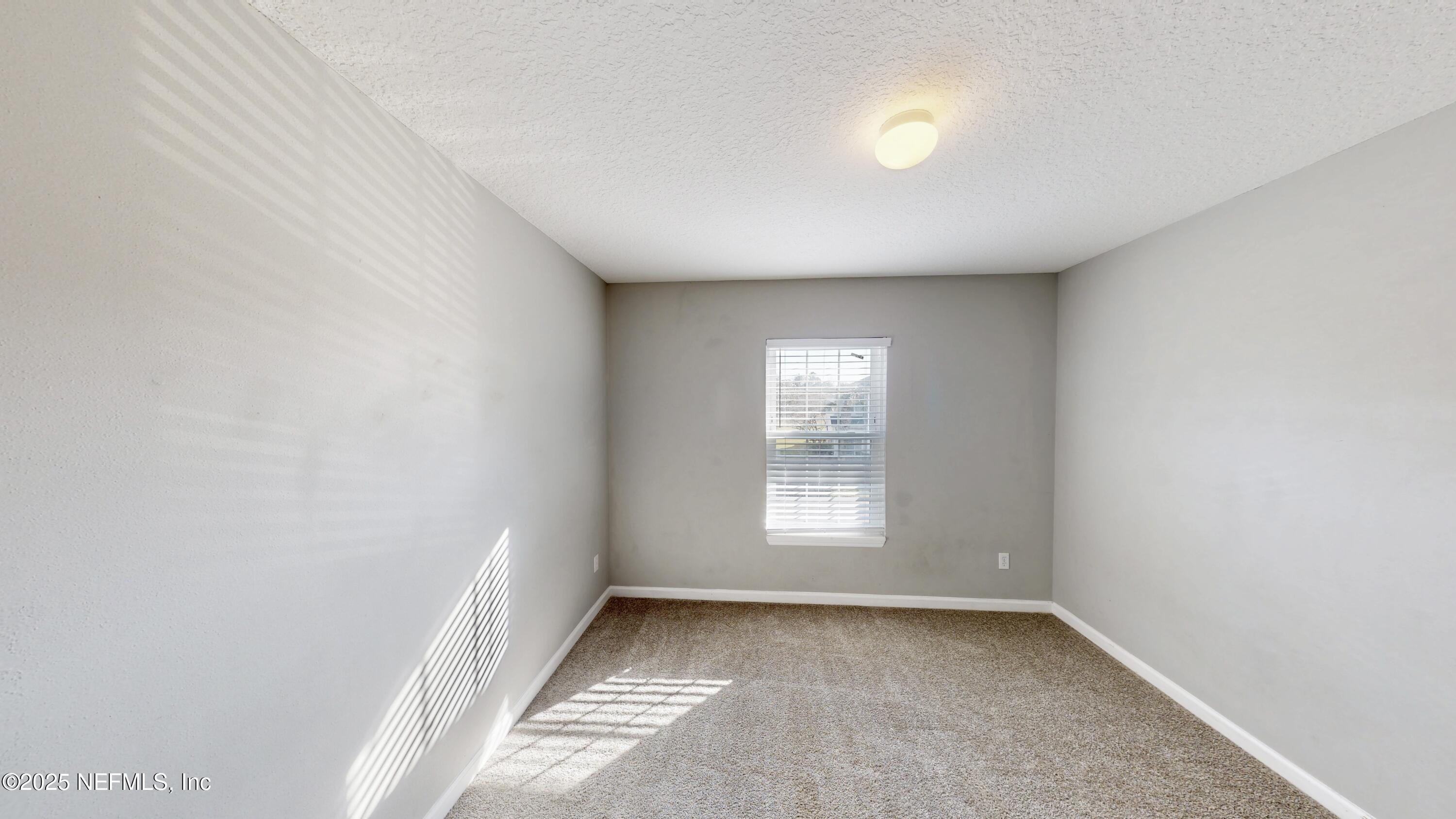 1445 Biscayne Bay Drive Jacksonville, FL 32218 - Photo 6 of 10 an empty room with a window
