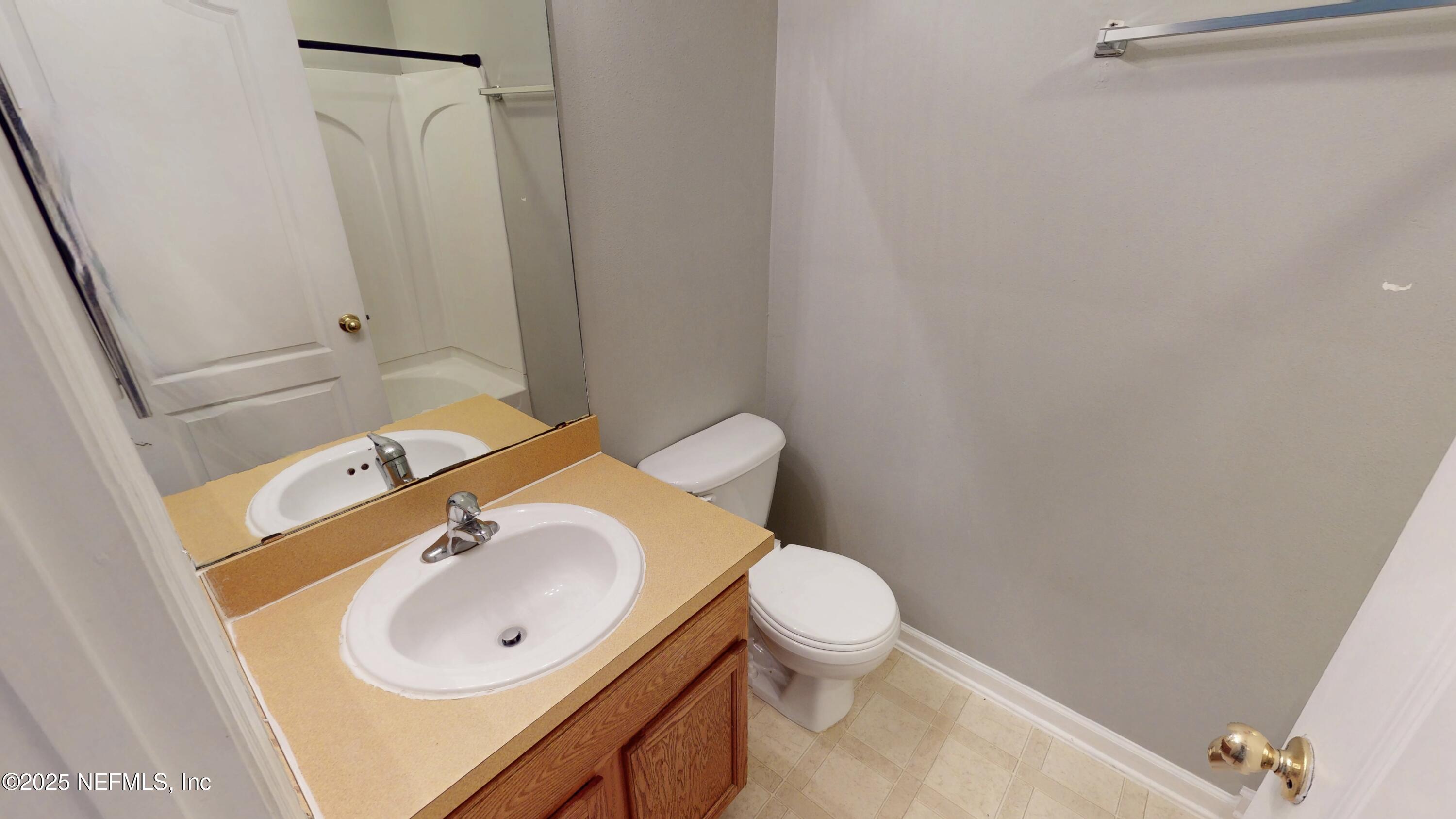 1445 Biscayne Bay Drive Jacksonville, FL 32218 - Photo 7 of 10 a bathroom with a sink toilet and shower