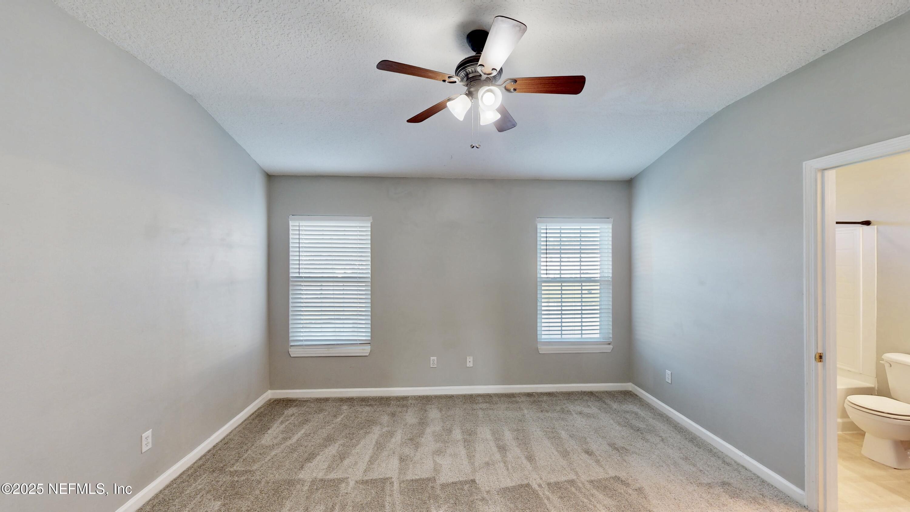 1445 Biscayne Bay Drive Jacksonville, FL 32218 - Photo 8 of 10 a view of an empty room with a window