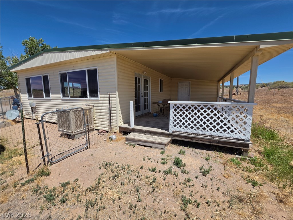 2930 Frehner Ranch Road Pioche, NV 89043 - Photo 8 of 39 A spacious covered porch offers comfortable outdoor living in a serene, natural setting.