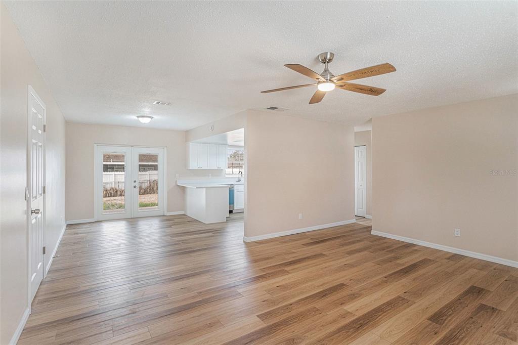 2527 Ridge Top Way Valrico, FL 33594 - Photo 10 of 29 a view of an empty room with a window and wooden floor