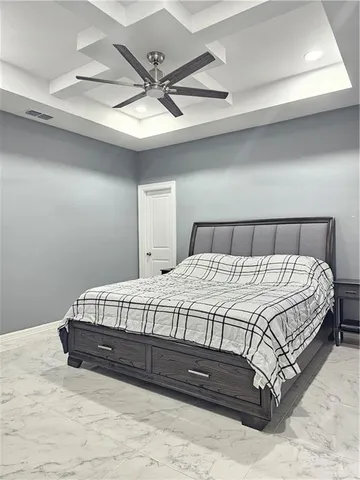 a bathroom with a granite countertop sink a toilet a mirror and shower