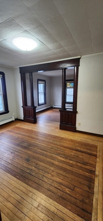 229 Rock Street, Unit 5 Fall River, MA 02720 - Photo 2 of 10 a view of a room with wooden floor and window