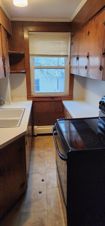 229 Rock Street, Unit 5 Fall River, MA 02720 - Photo 7 of 10 a kitchen with a sink and a stove top oven
