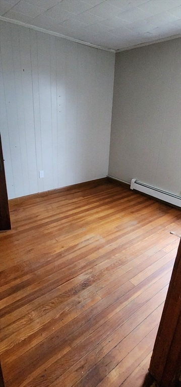 229 Rock Street, Unit 5 Fall River, MA 02720 - Photo 9 of 10 a view of empty room with wooden floor