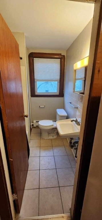 229 Rock Street, Unit 5 Fall River, MA 02720 - Photo 10 of 10 a bathroom with a toilet a sink a mirror and bathtub