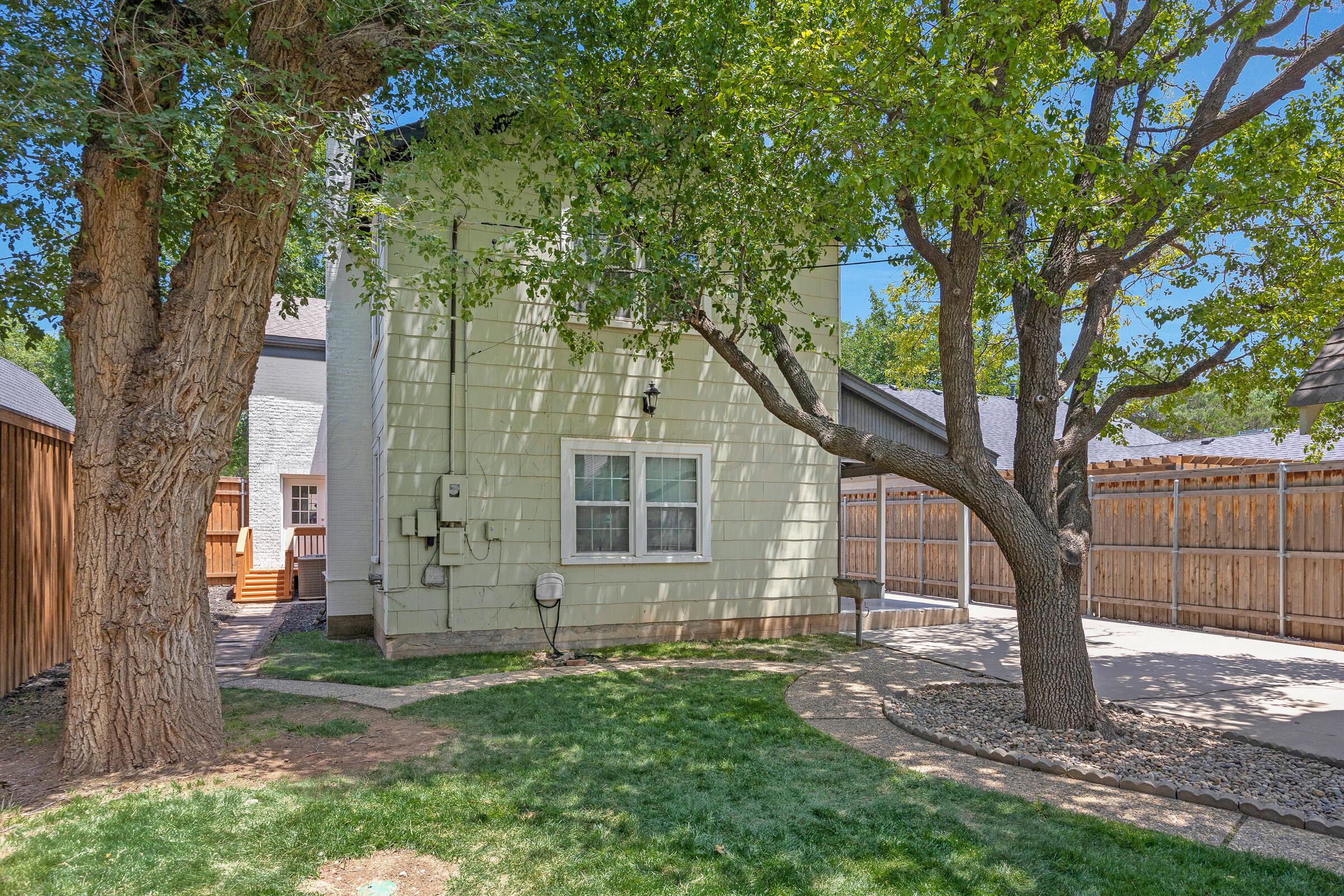 2102 South Hayden Street Amarillo, TX 79109 - Photo 41 of 44 a view of a yard in front of a tree
