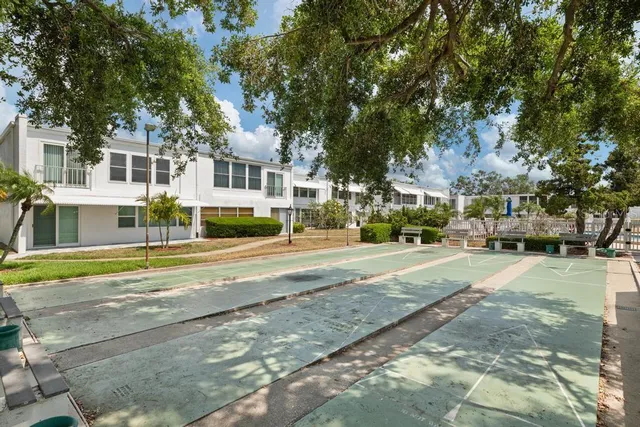 a view of swimming pool with two chairs