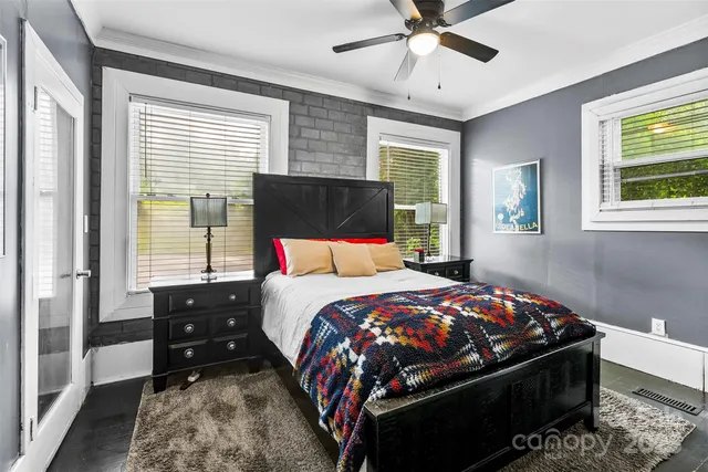 a bedroom with bed and window