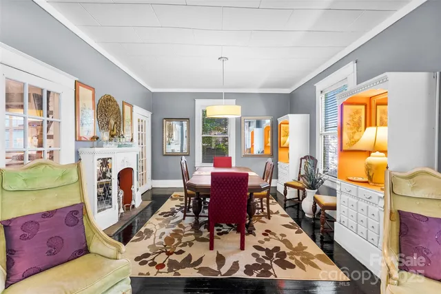 a living room with furniture fireplace and a window