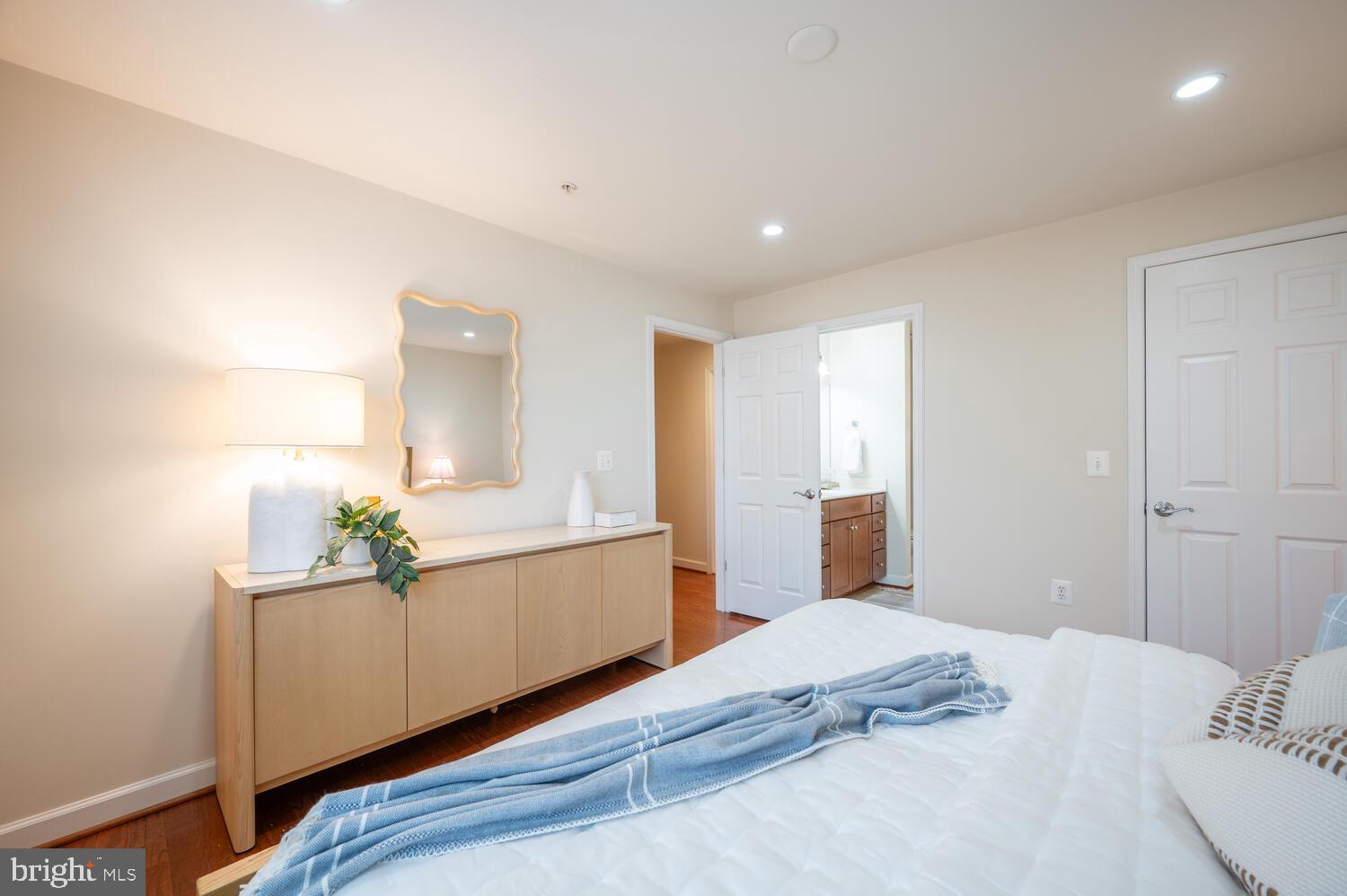 4113 South Four Mile Run Drive, Unit 404 Arlington, VA 22204 - Photo 11 of 39 a bedroom with a bed and window