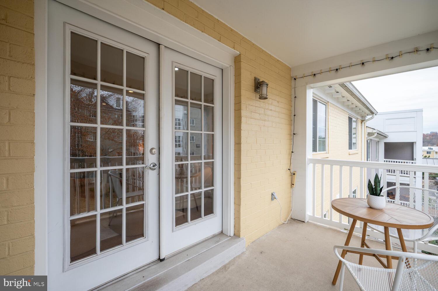 4113 South Four Mile Run Drive, Unit 404 Arlington, VA 22204 - Photo 21 of 39 a view of a bedroom with furniture and window