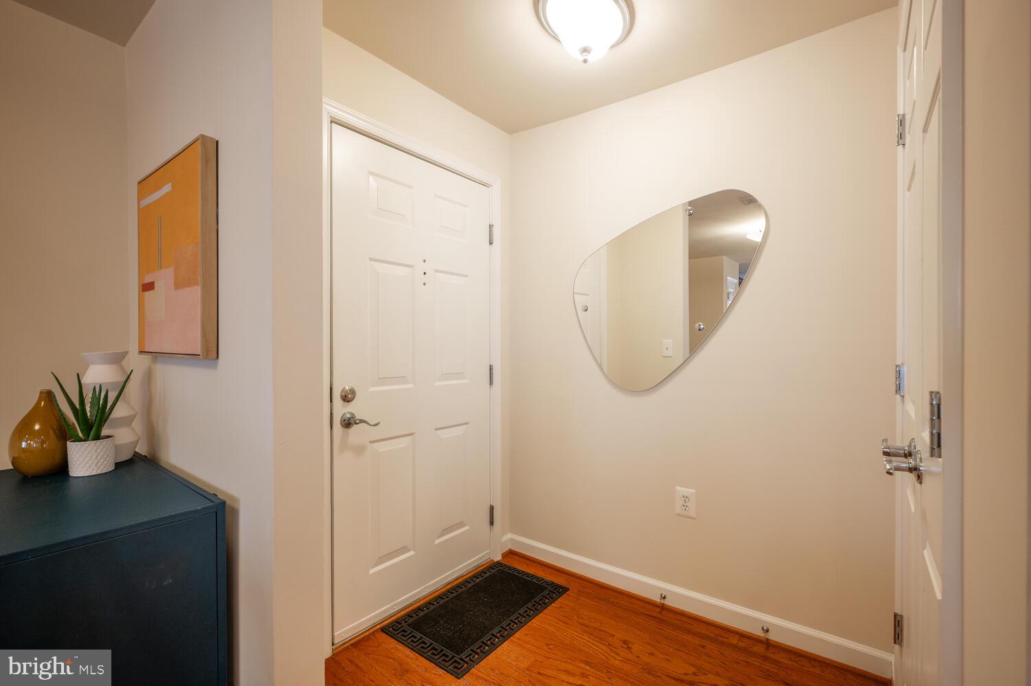 4113 South Four Mile Run Drive, Unit 404 Arlington, VA 22204 - Photo 25 of 39 a bathroom with a sink and mirror