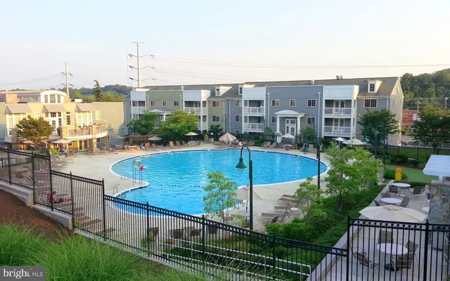 a living room with furniture fireplace and flat screen tv