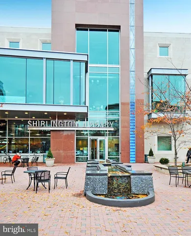 a view of a patio with a table chairs and a potted plant
