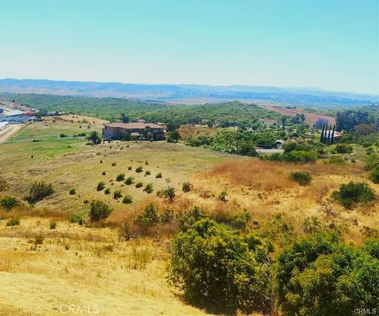 a view of a lake with beach and city
