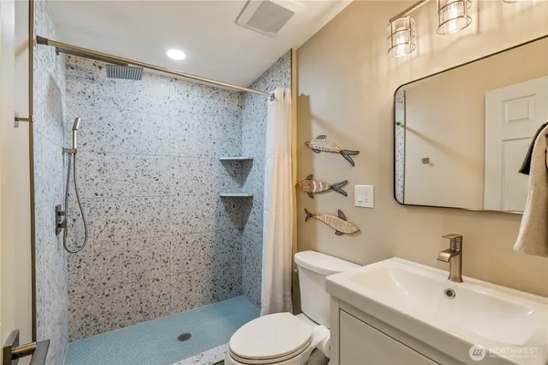 a kitchen with stainless steel appliances granite countertop a refrigerator stove and microwave