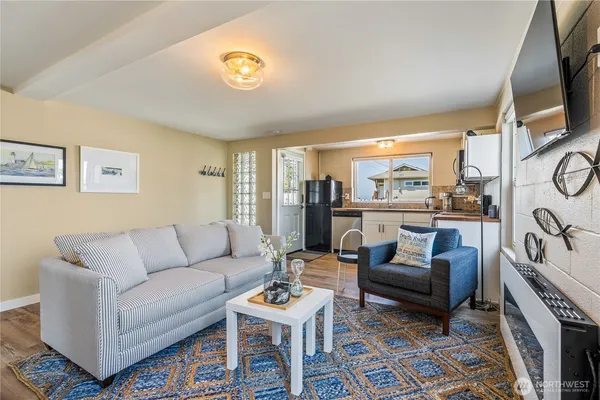 a living room with furniture fireplace and a flat screen tv