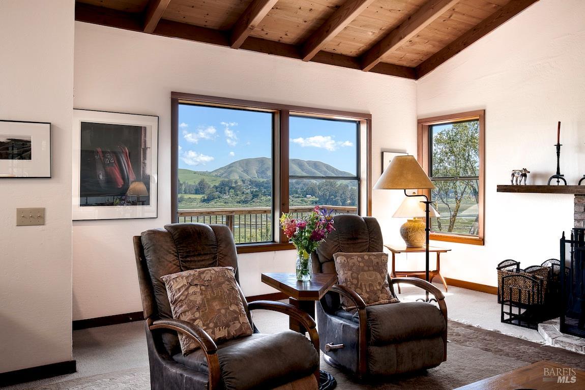 57 Laurel Street Inverness, CA 94956 - Photo 14 of 45 a living room with furniture and a floor to ceiling window
