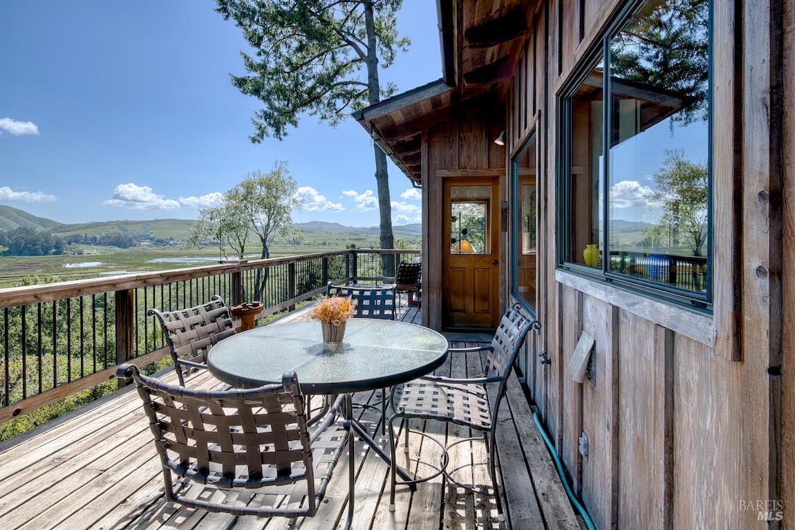 57 Laurel Street Inverness, CA 94956 - Photo 17 of 45 a view of a chairs and table in the balcony