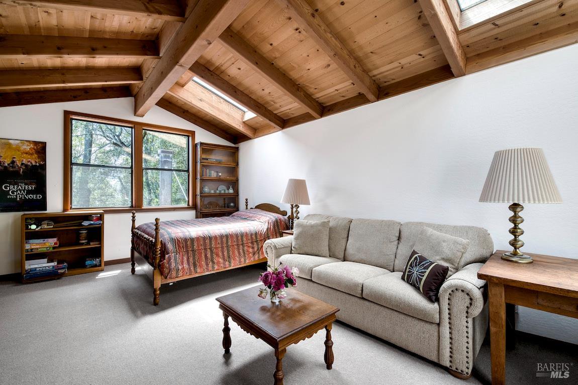 57 Laurel Street Inverness, CA 94956 - Photo 25 of 45 a bedroom with furniture and a large window