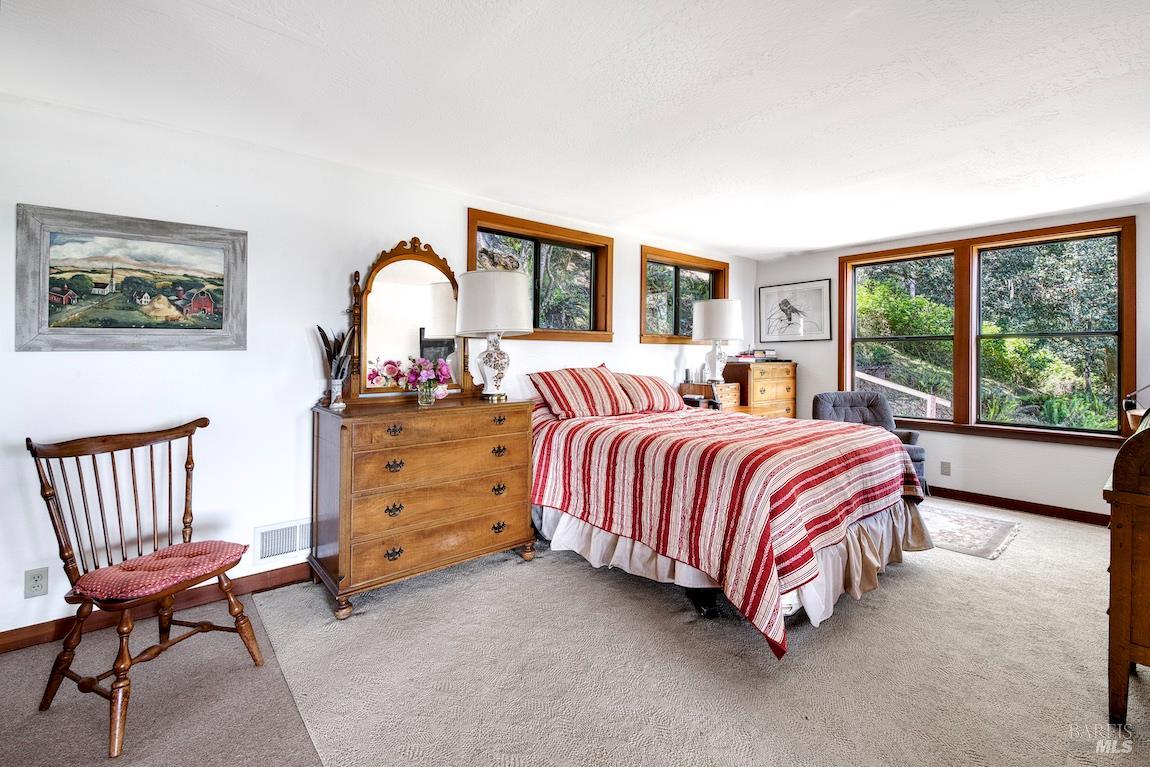 57 Laurel Street Inverness, CA 94956 - Photo 28 of 45 a bedroom with a bed chair and a window