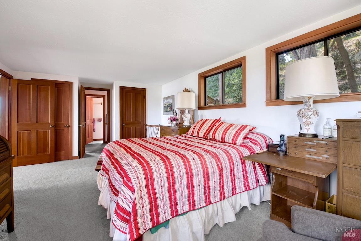 57 Laurel Street Inverness, CA 94956 - Photo 29 of 45 a bedroom with a bed and window