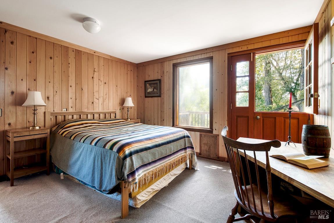 57 Laurel Street Inverness, CA 94956 - Photo 39 of 45 a bedroom with a bed and a table
