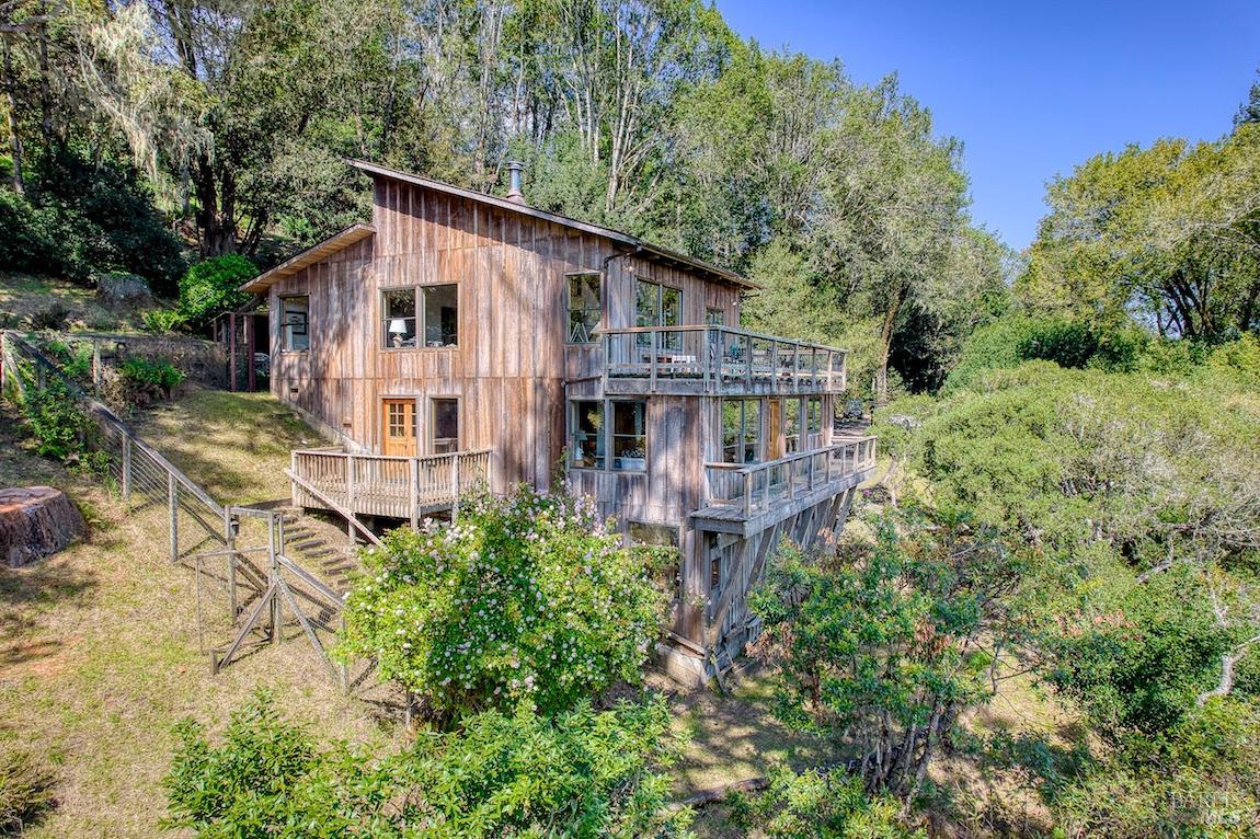 57 Laurel Street Inverness, CA 94956 - Photo 10 of 45 an aerial view of a house with balcony and trees al around
