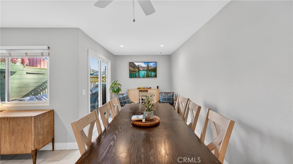 809 North Spurgeon Street, Unit 2 Santa Ana, CA 92701 - Photo 11 of 14 Beyond the dining table, there are two more chairs, a credenza and the door that leads to the back patio. You have to see the space in person to really understand how large this space is.