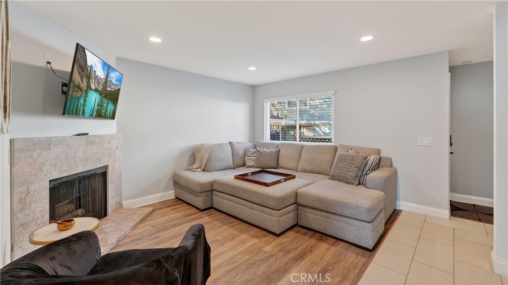 809 North Spurgeon Street, Unit 2 Santa Ana, CA 92701 - Photo 4 of 14 The living room is pretty good sized and include a fireplace for those cozy nights.