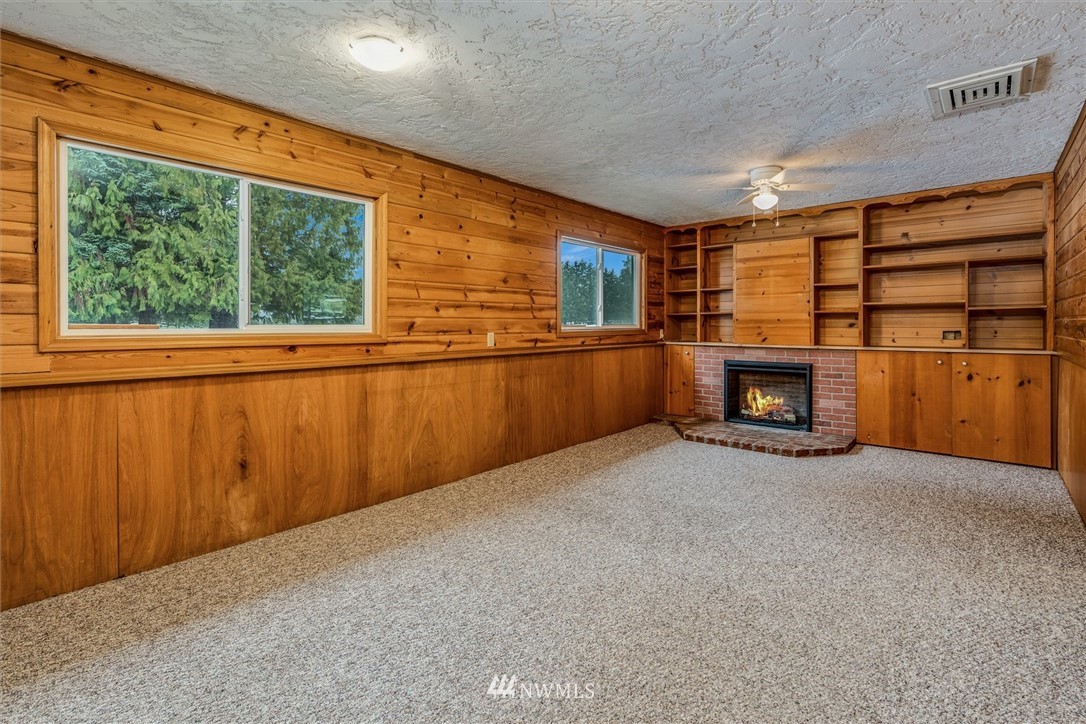131 Tingle Road Winlock, WA 98596 - Photo 17 of 31 a view of an empty room with furniture and a fireplace