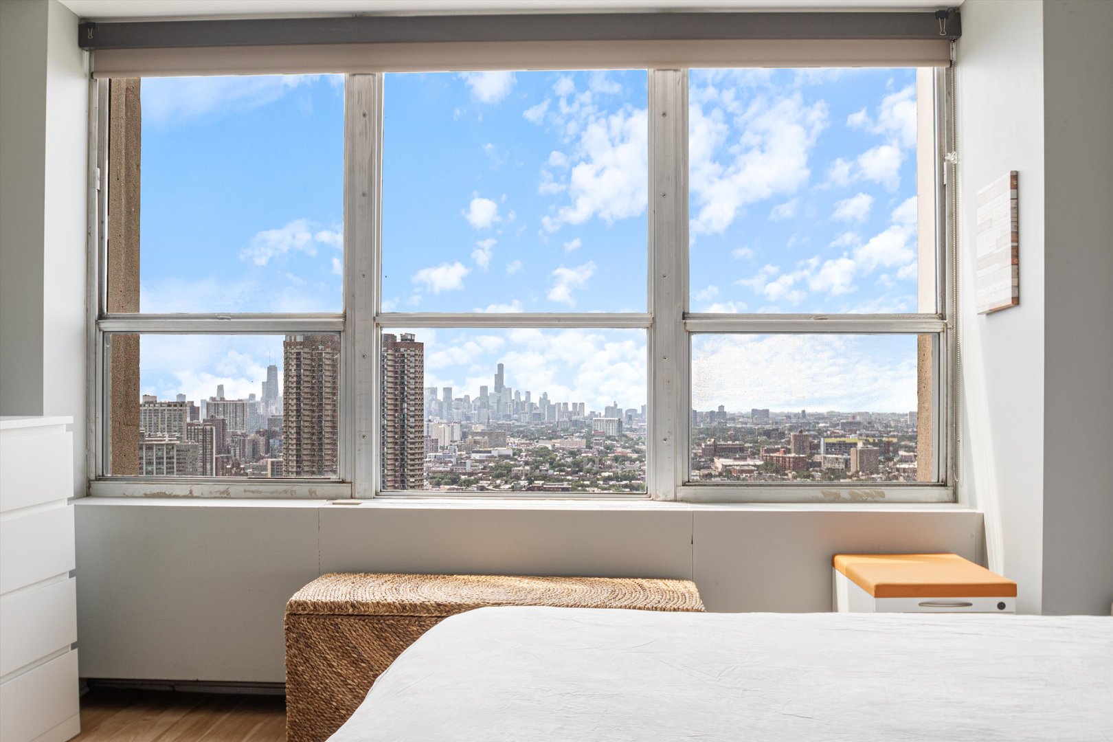 655 West Irving Park Road, Unit 3717 Chicago, IL 60613 - Photo 12 of 24 a bedroom with furniture and a large window