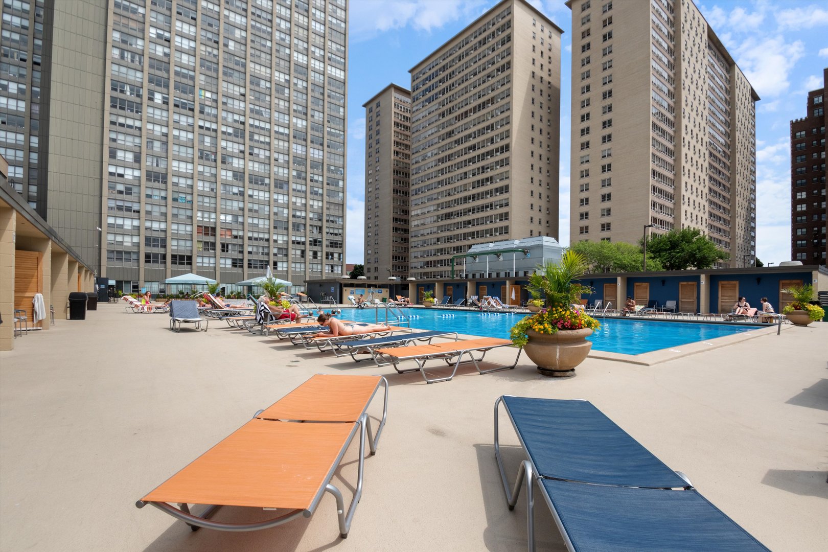 655 West Irving Park Road, Unit 3717 Chicago, IL 60613 - Photo 16 of 24 a view of a patio with dining table and chairs and potted plants