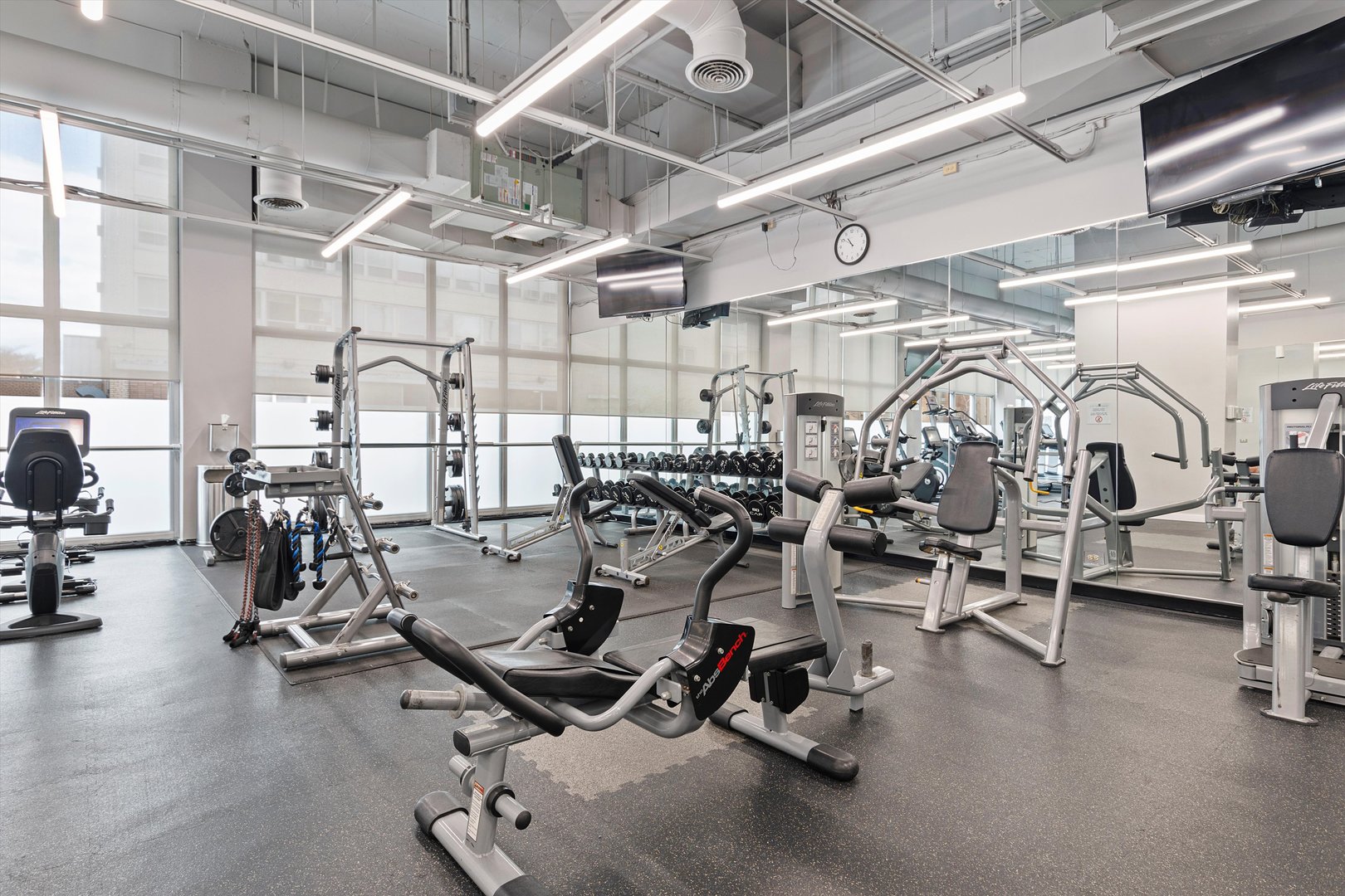 655 West Irving Park Road, Unit 3717 Chicago, IL 60613 - Photo 19 of 24 a view of a room with gym equipment
