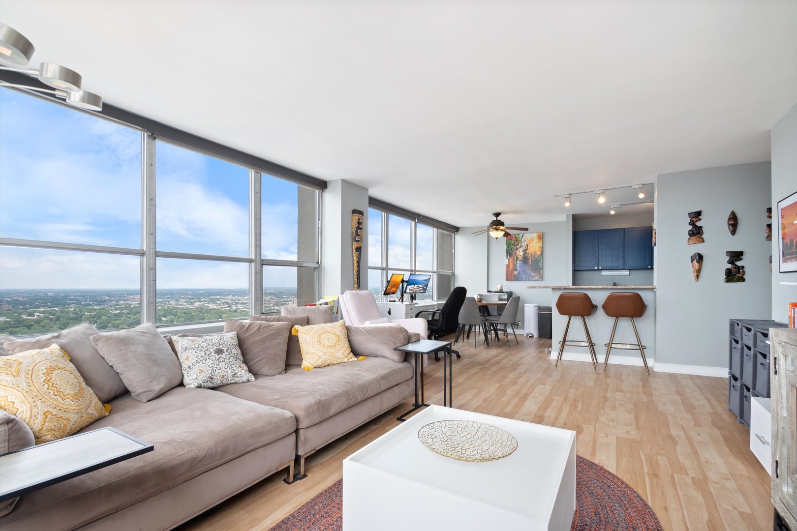 655 West Irving Park Road, Unit 3717 Chicago, IL 60613 - Photo 4 of 24 a living room with furniture and a large window