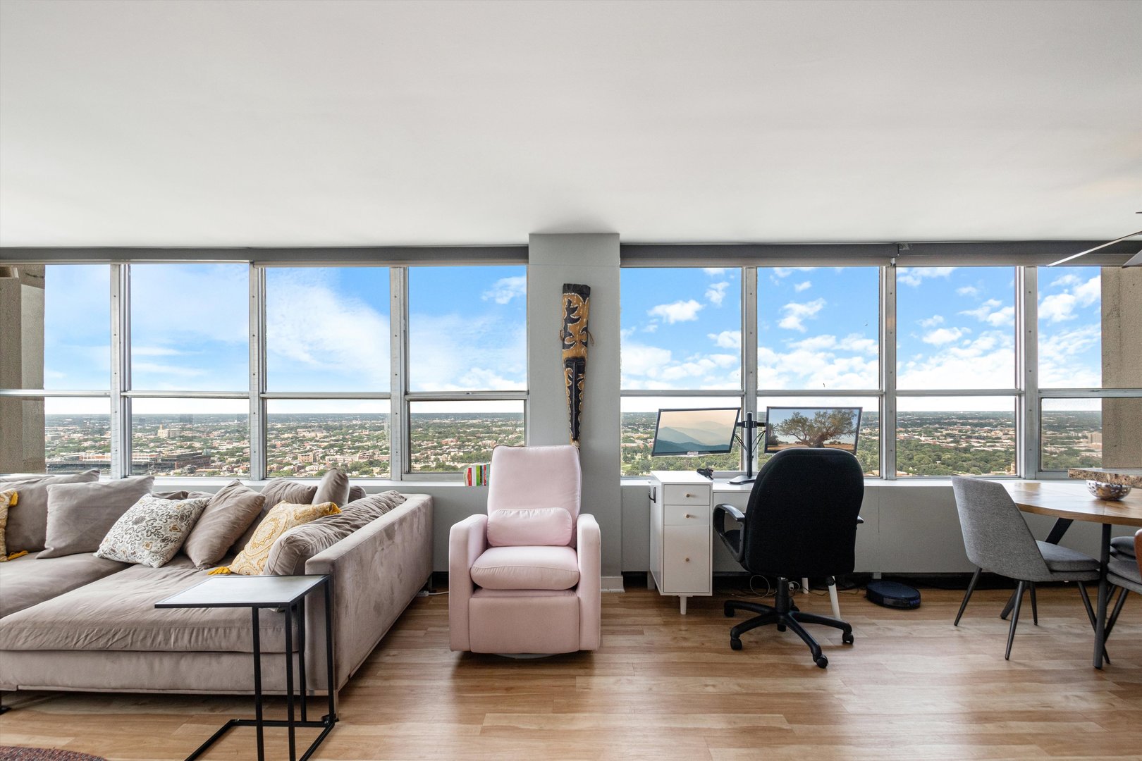 655 West Irving Park Road, Unit 3717 Chicago, IL 60613 - Photo 5 of 24 a living room with furniture and large windows