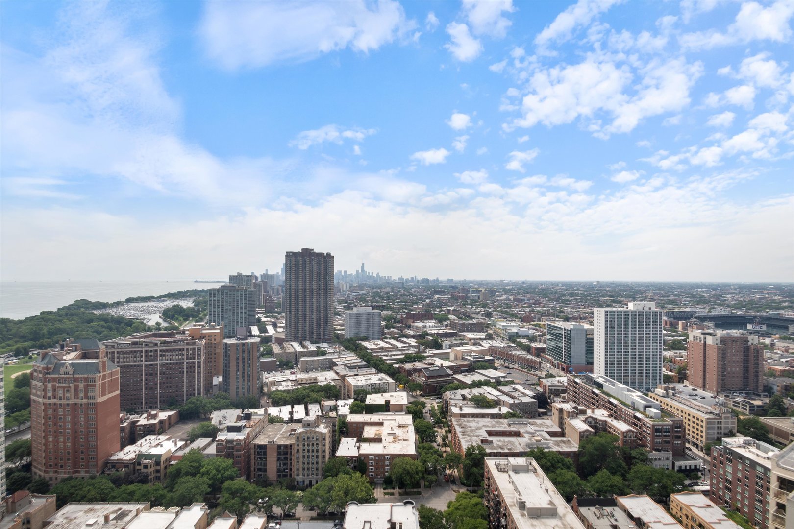 655 West Irving Park Road, Unit 3717 Chicago, IL 60613 - Photo 6 of 24 a view of a city with tall buildings