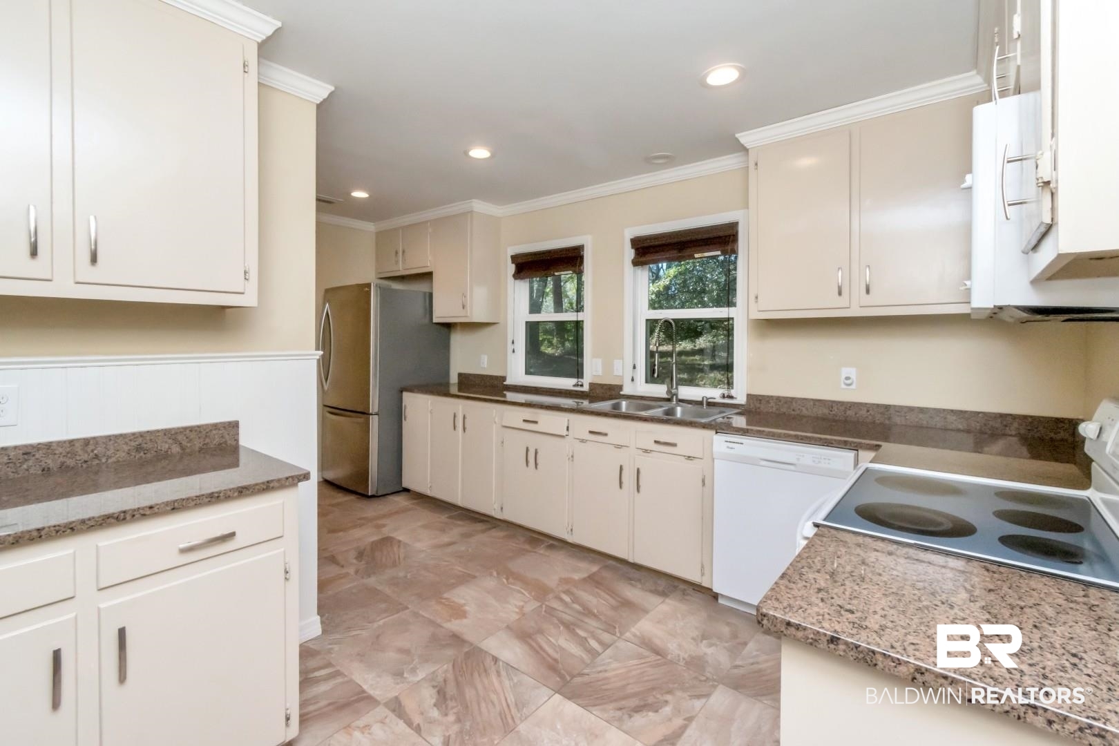 410 St John Place Mobile, AL 36609 - Photo 9 of 32 Kitchen featuring white appliances, ornamental molding, recessed lighting, and dark stone countertops